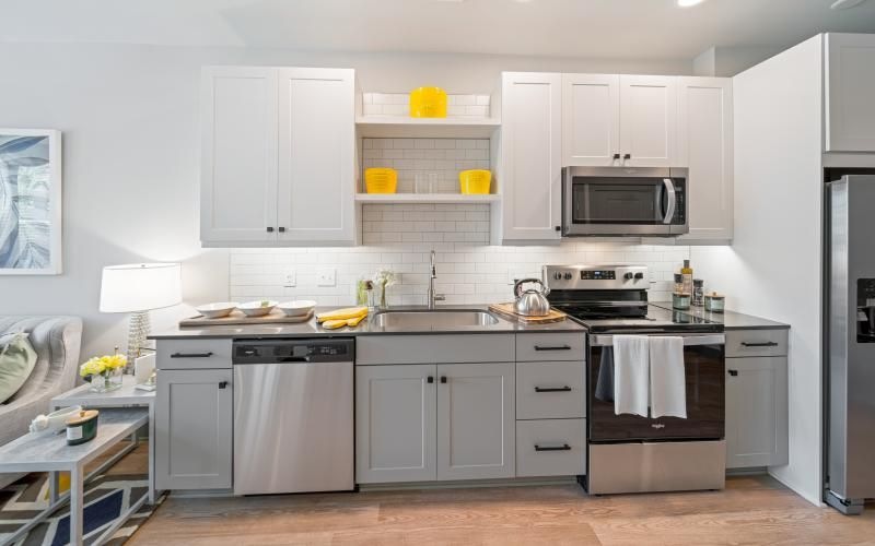 a kitchen with white cabinets