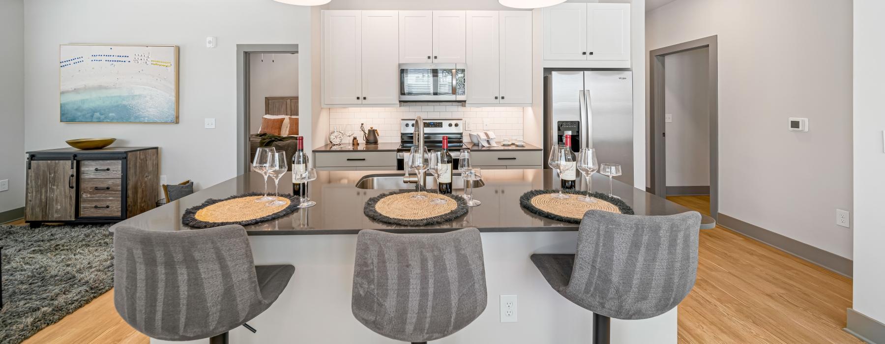 a kitchen with a table and chairs