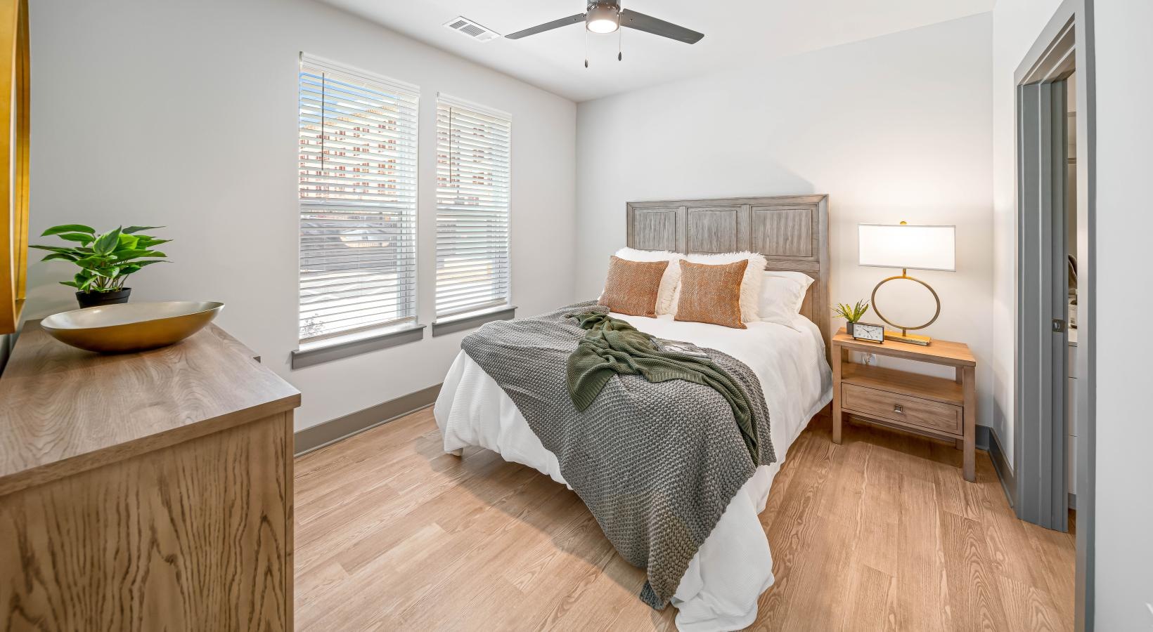 Beautiful bedrooms to fit every need a bedroom with a bed and a fan