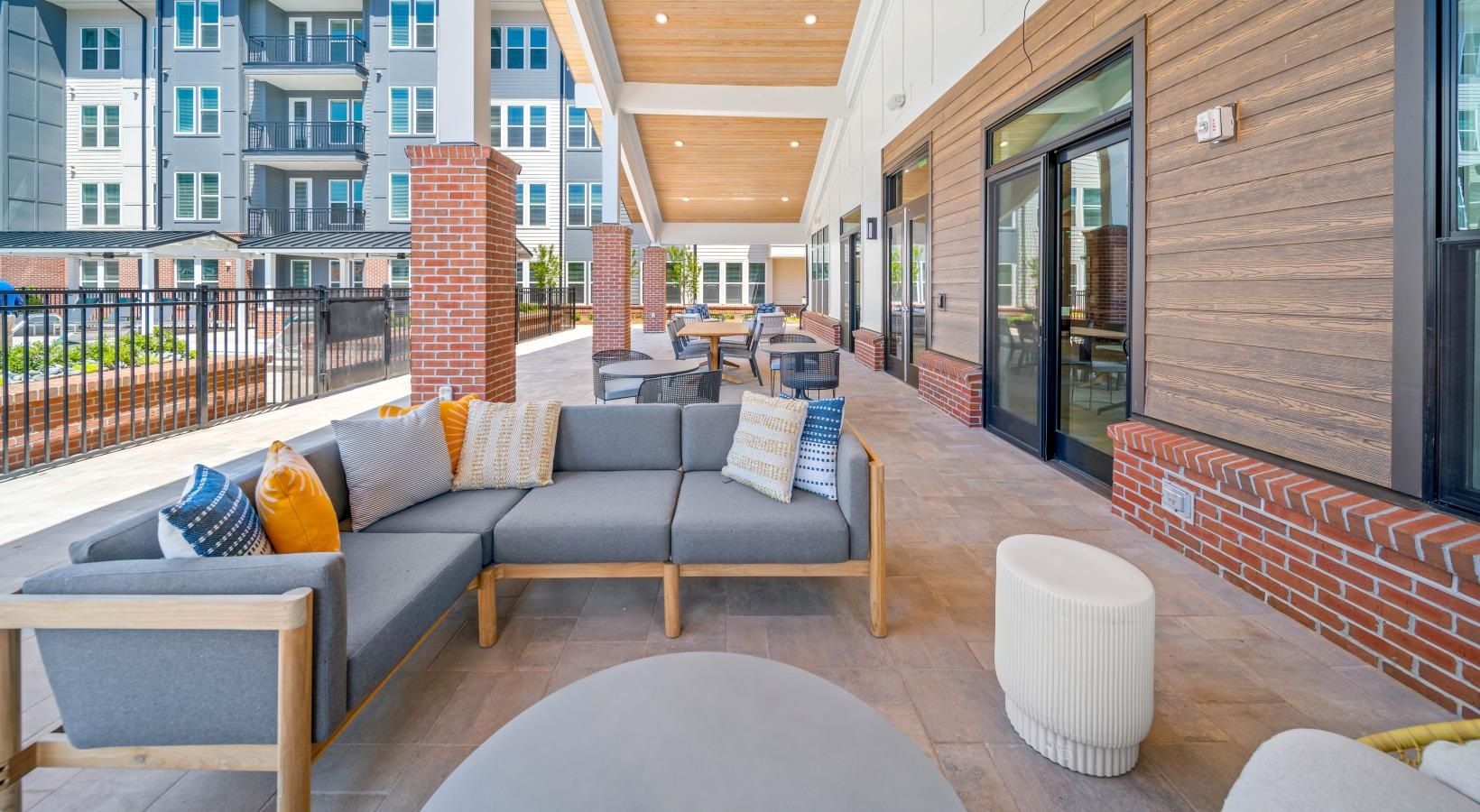 Access to resident-only features a patio with a table and chairs