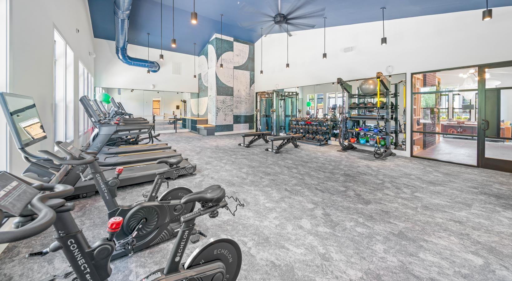 Cutting-edge amenities at your fingertips a gym with workout equipment
