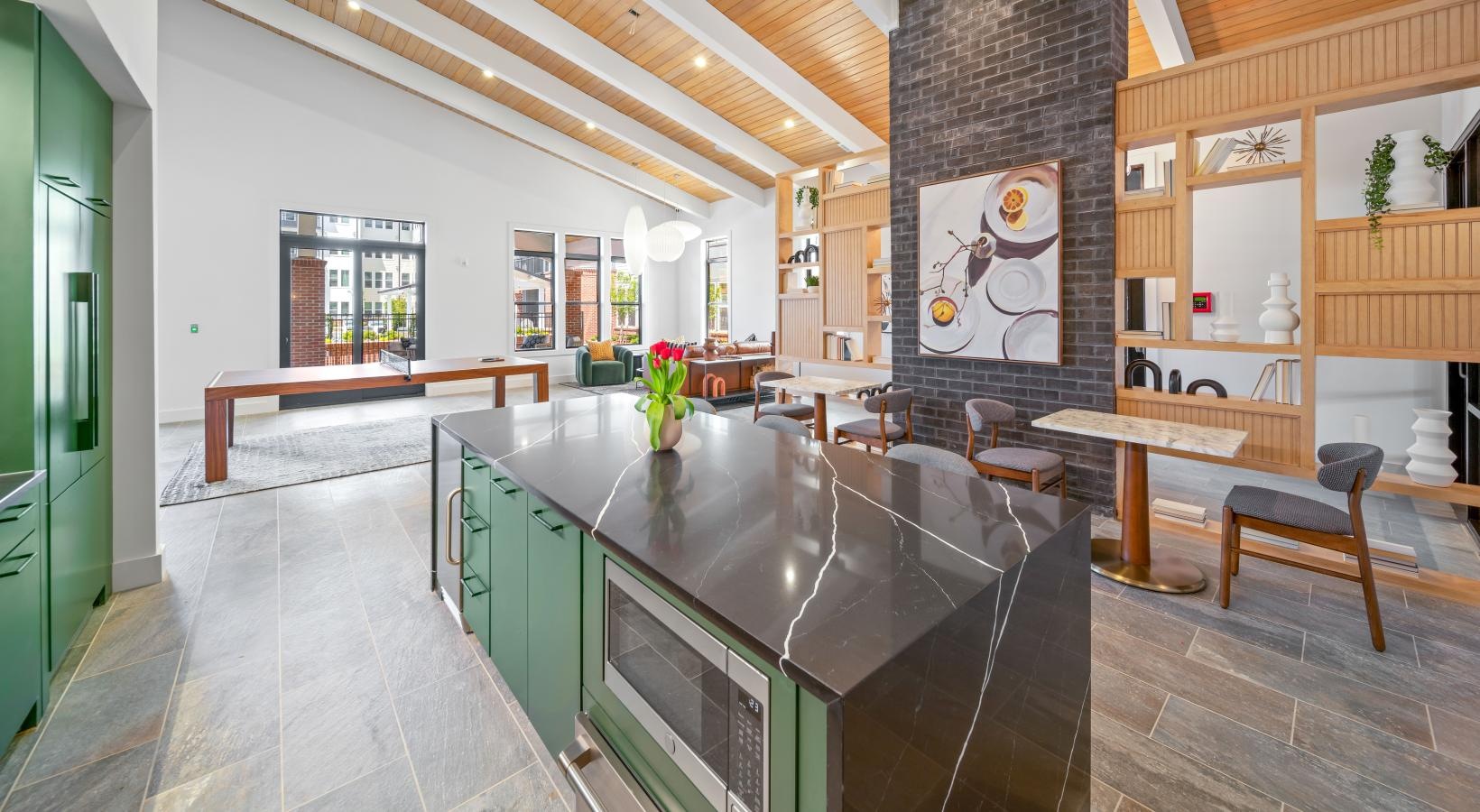 Close to the center of everything a large kitchen with a bar and chairs