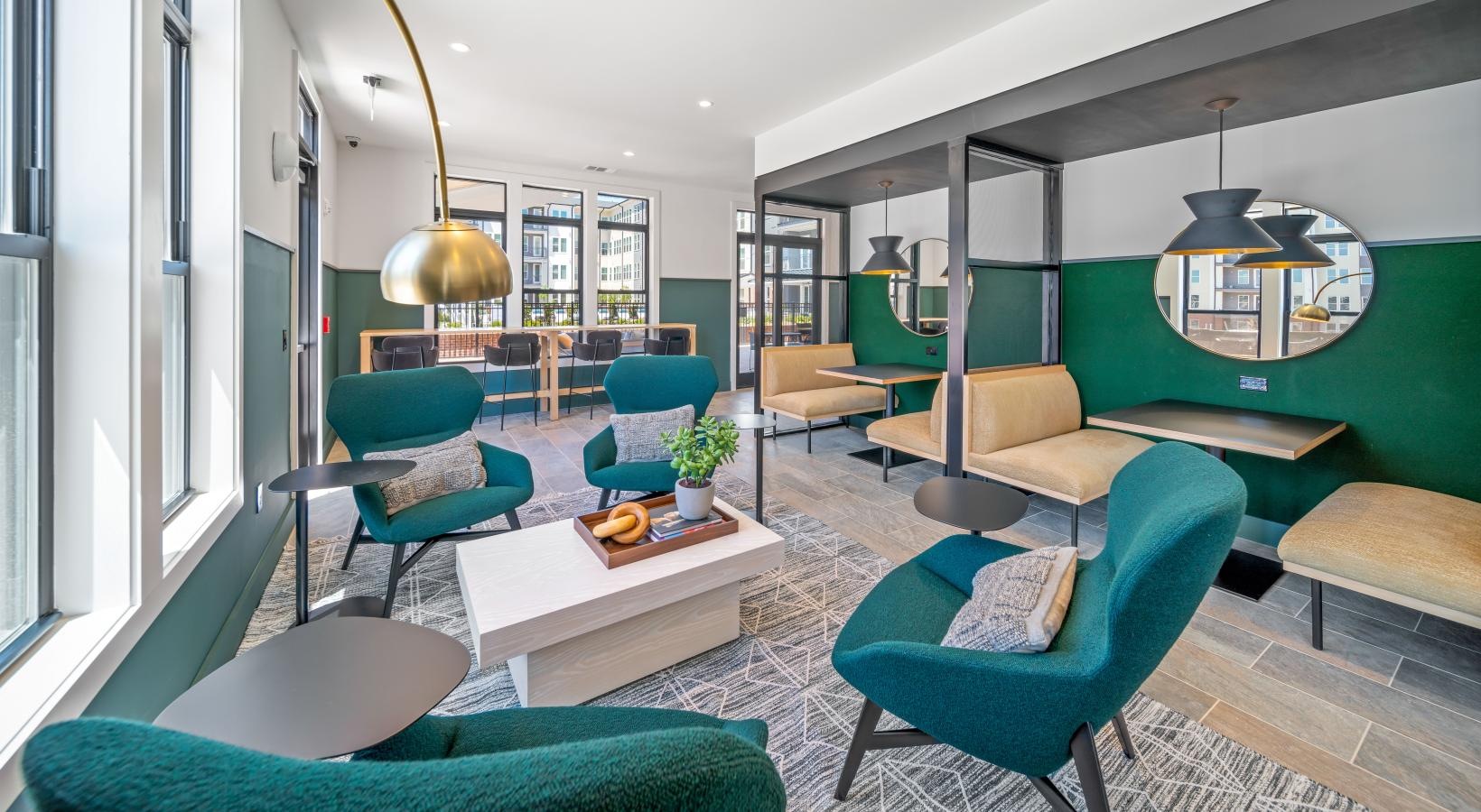 Access to resident-only features a room with a table chairs and a couch