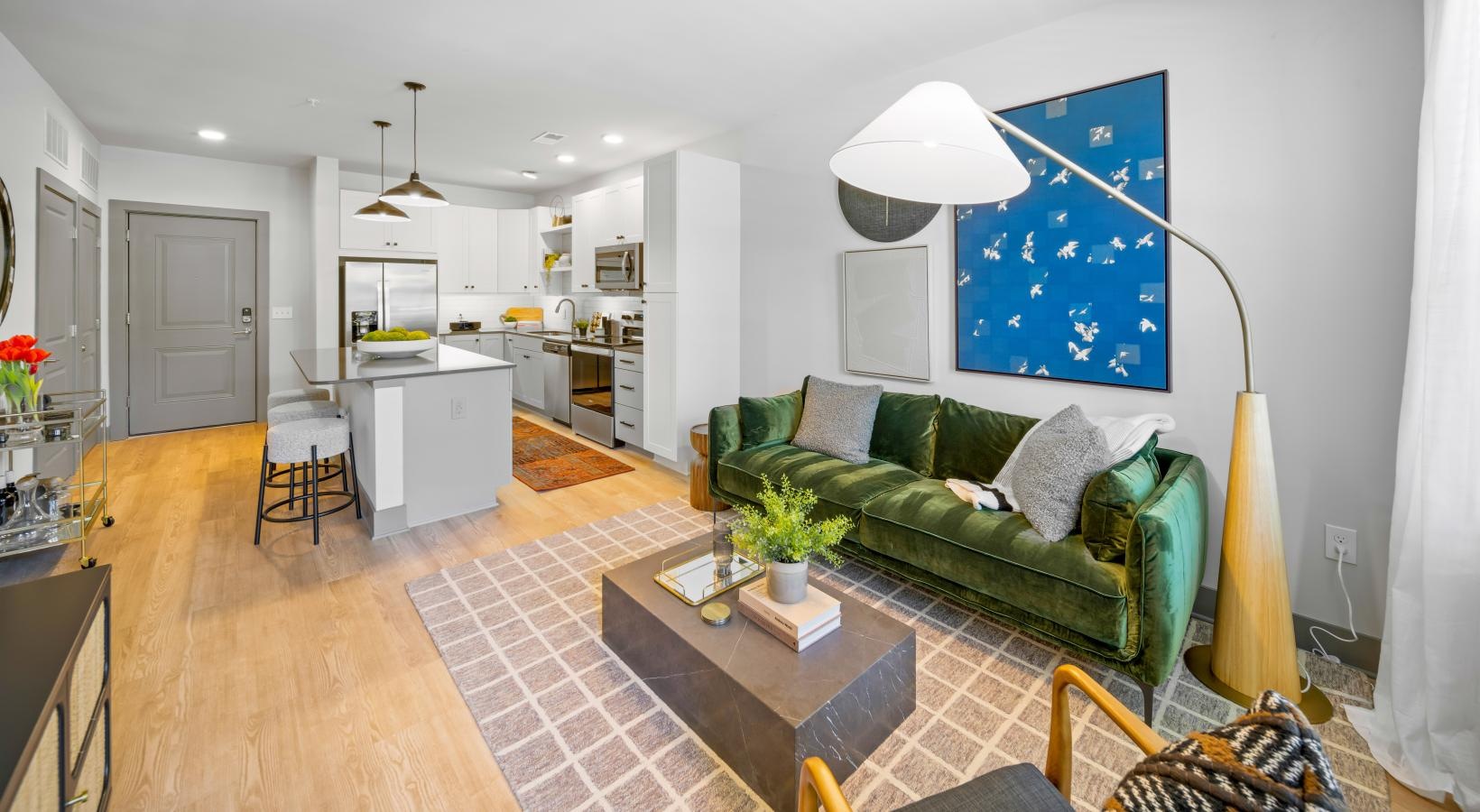 Beautiful bedrooms to fit every need a living room with a green couch