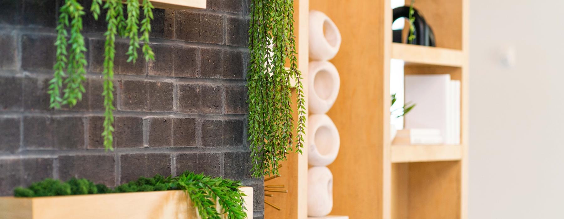 The essence of exceptional living a fireplace with a shelf and a planter