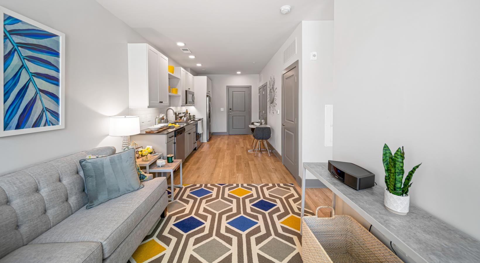 Relax and recharge in beautiful and spacious bedrooms a living room with a couch and a table