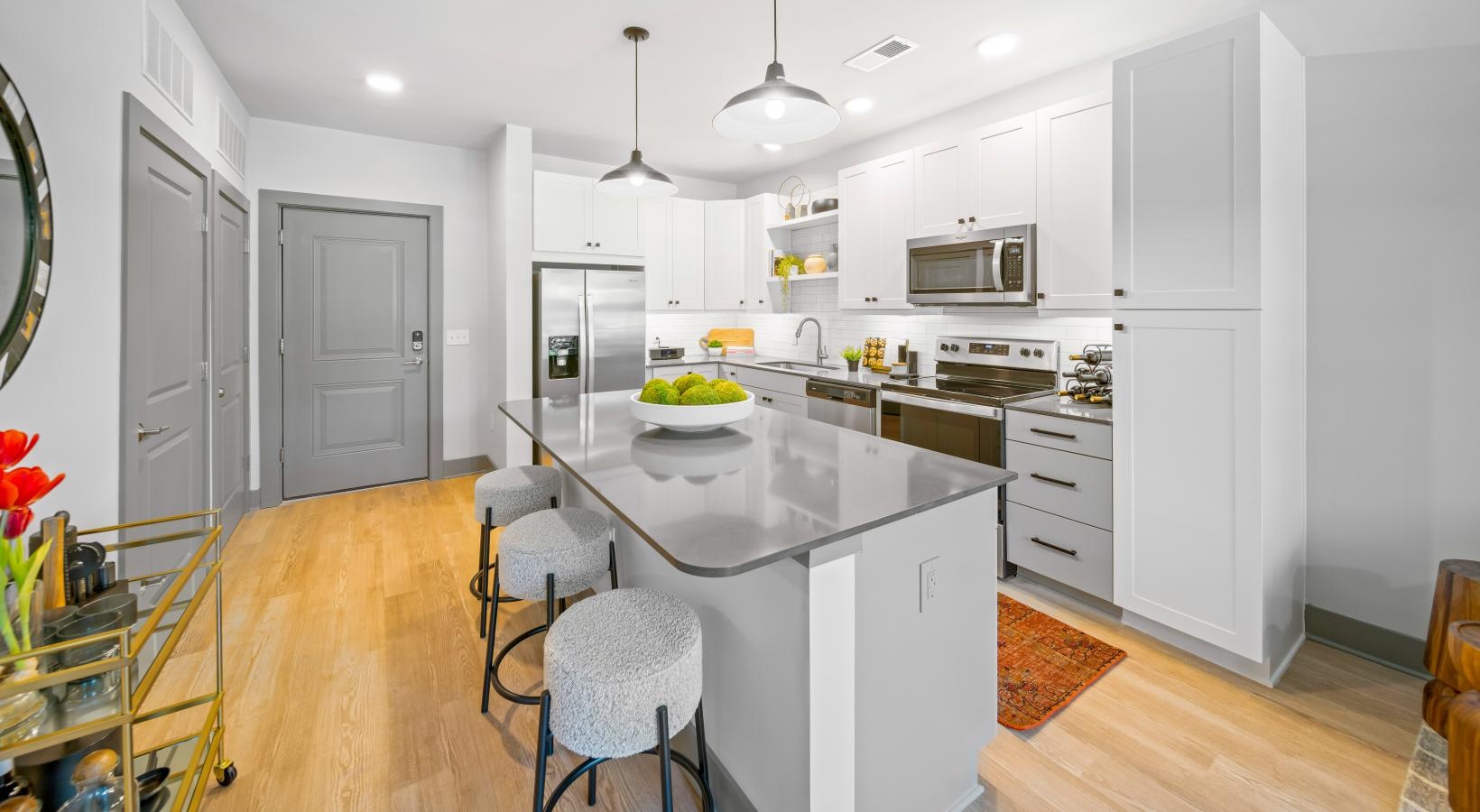 Beautiful living areas to match your lifestyle a kitchen with white cabinets