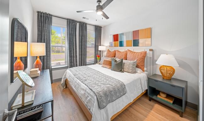 Beautiful bedrooms to fit every need a bedroom with a bed and lamps