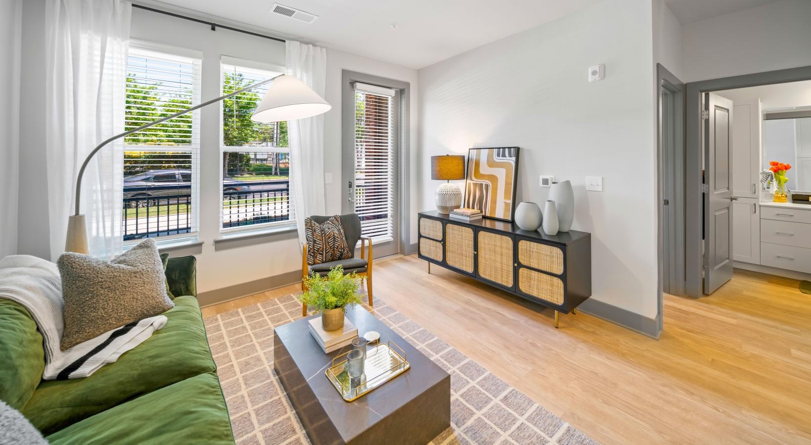 Generous living spaces with beautiful natural lighting a living room with a large window